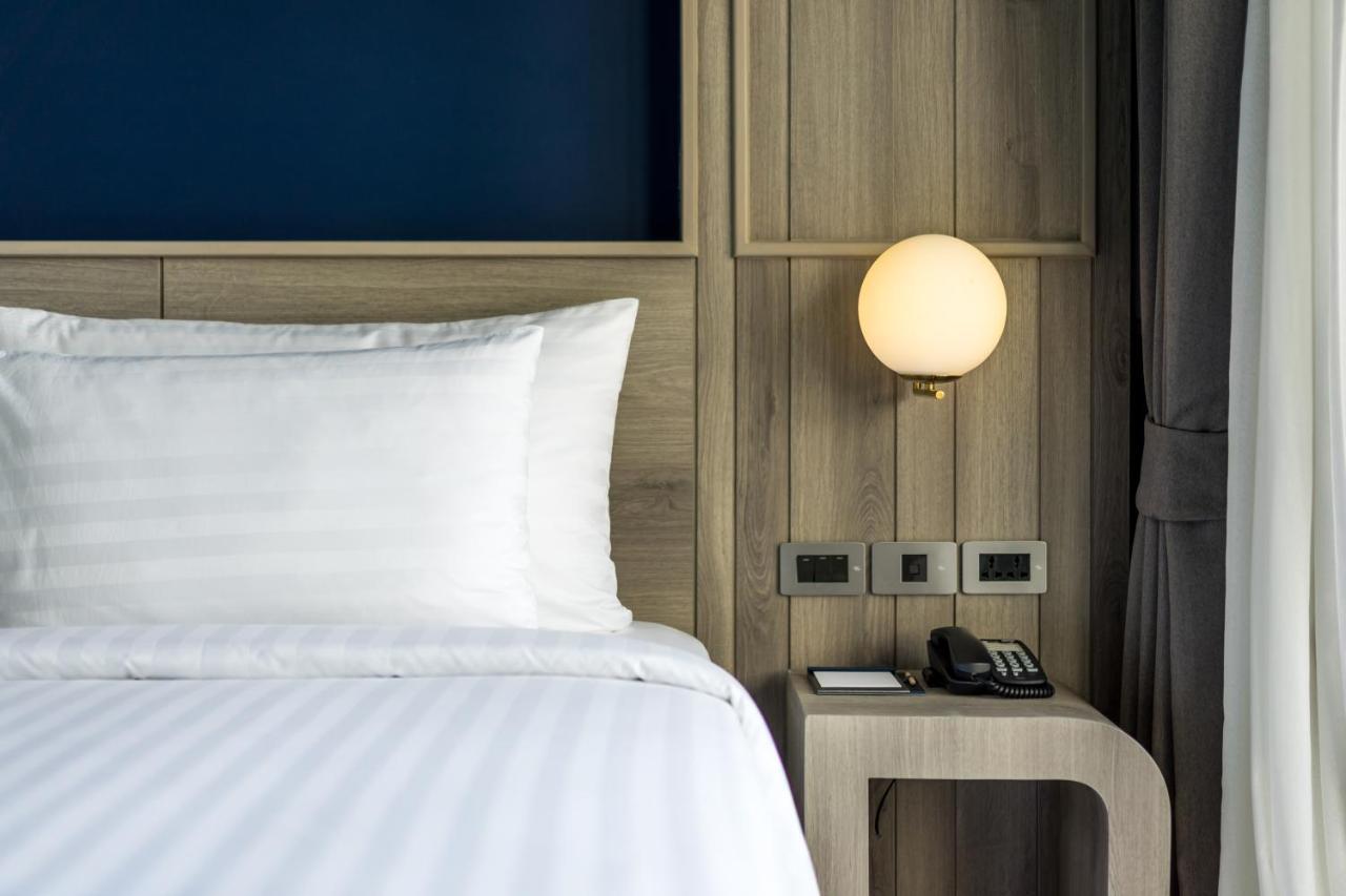 Seabed Grand Hotel Phuket - Sha Extra Plus Экстерьер фото A wall-mounted light